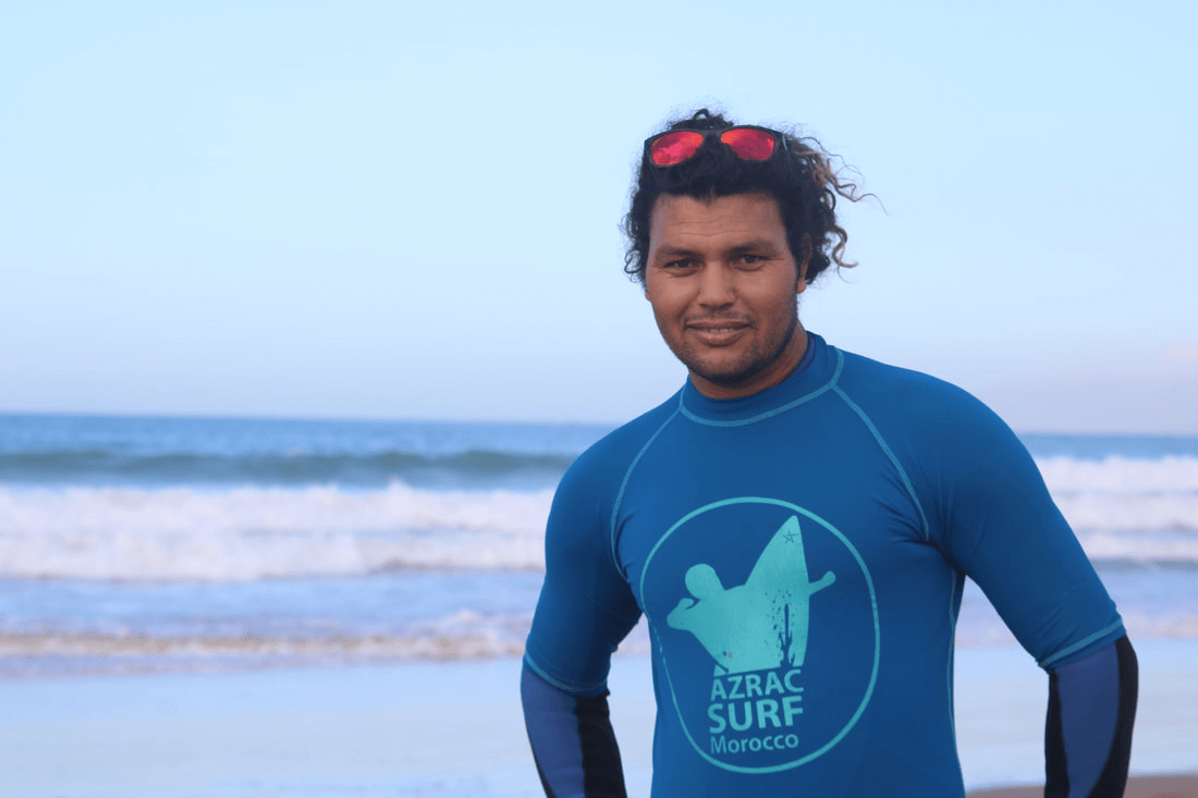 Surf instructor in front of the beach in Taghazout